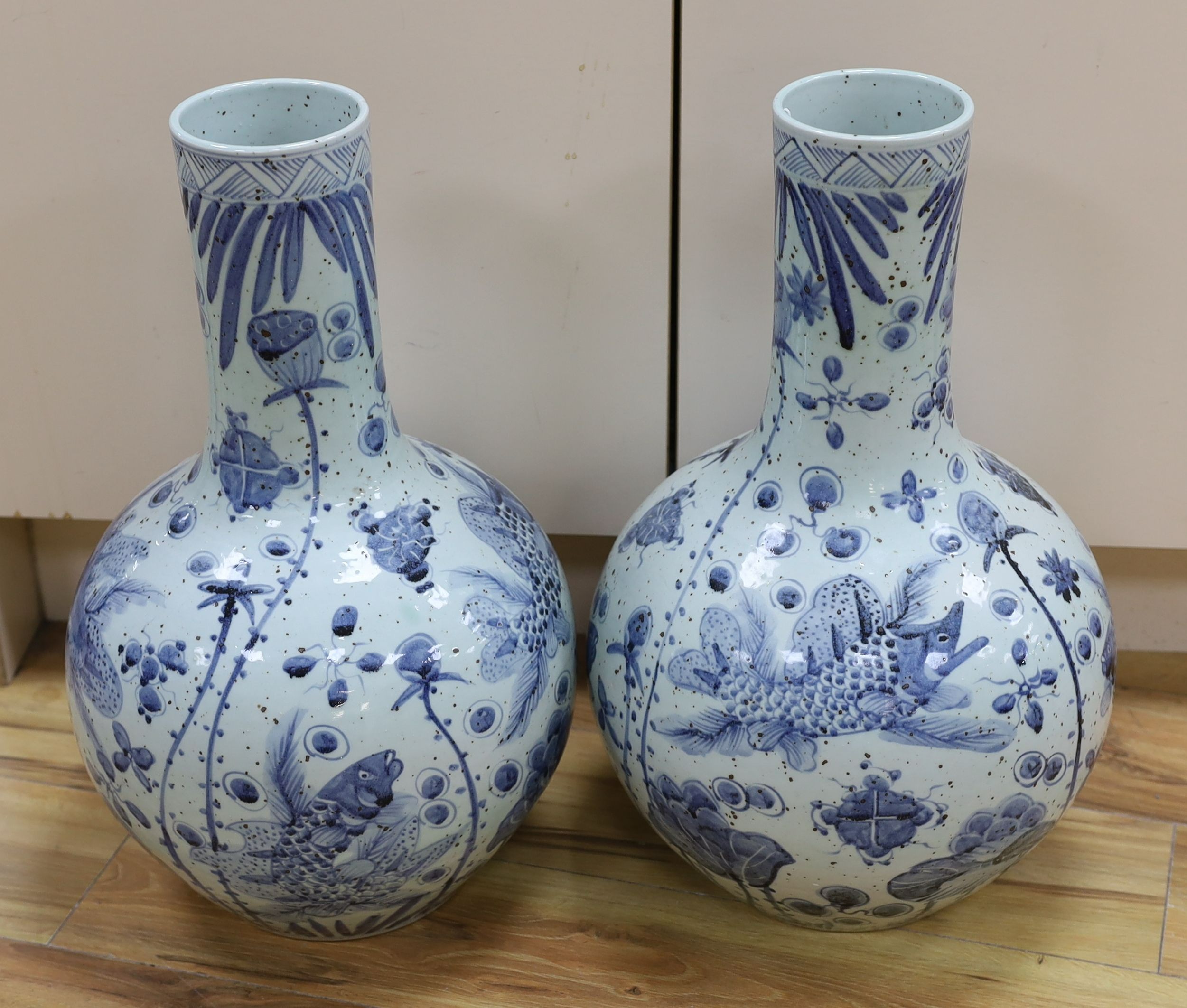 A pair of large Chinese vases, coy carp and floral, 56cms high.